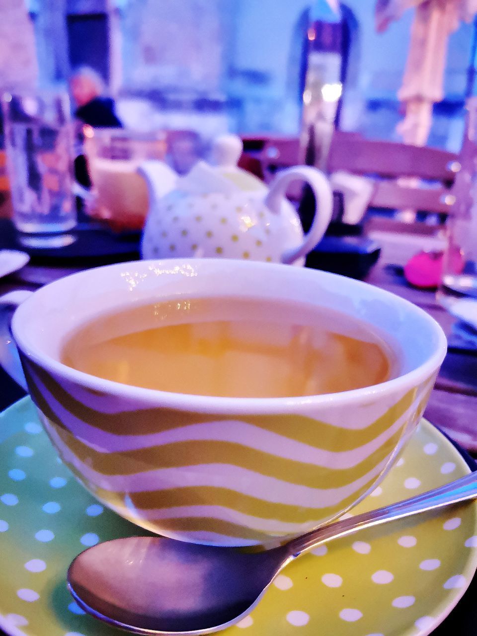 CLOSE-UP OF CUP OF COFFEE ON TABLE