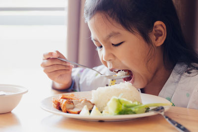 Portrait of woman eating food