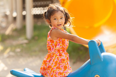 Portrait of a smiling girl in playground