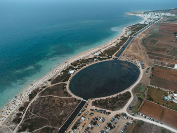 High angle view of sea shore against sky