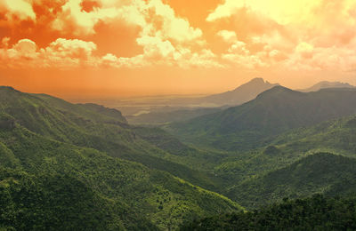 Scenic view of mountains against sky during sunset