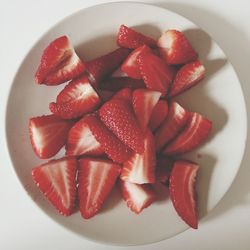 Close-up of strawberry over white background