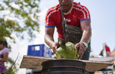 Midsection of man preparing food