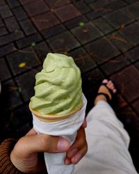Midsection of person holding ice cream