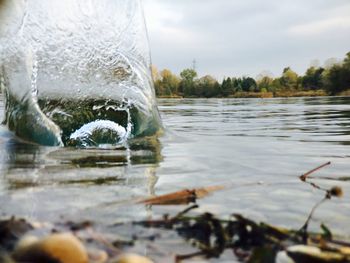 Close-up of river against sky