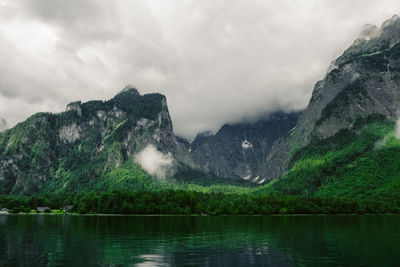 Scenic view of lake and mountains against sky