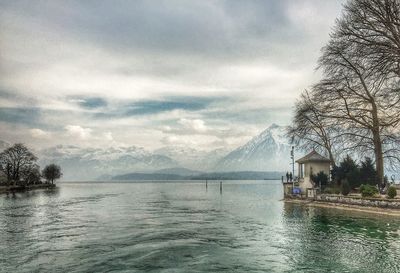 Scenic view of sea against cloudy sky