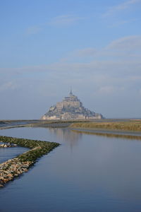 Reflection of building in water  mont saint michel normandy