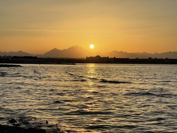 Scenic view of sea against sky during sunset