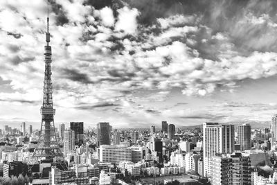 City skyline against cloudy sky