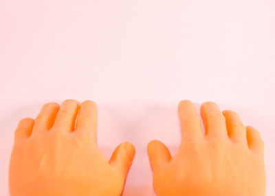 Close-up of human hand against white background