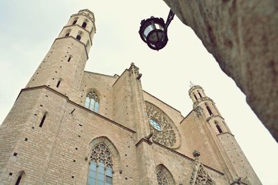 Low angle view of bell tower against sky