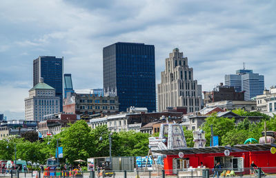 Skyscrapers in city against sky