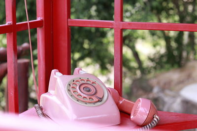 Close-up of telephone booth on table