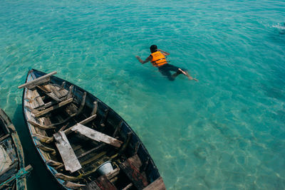 High angle view of man swimming in sea