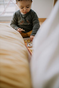 Cute boy playing at home