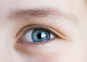 Blue eye of a child closeup,look, eyelashes, iris, vision,