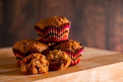 Appetizing homemade muffins on a wooden cutting board. traditional festive christmas baking.