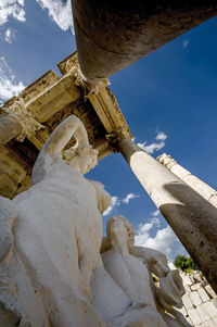 Low angle view of statue against building