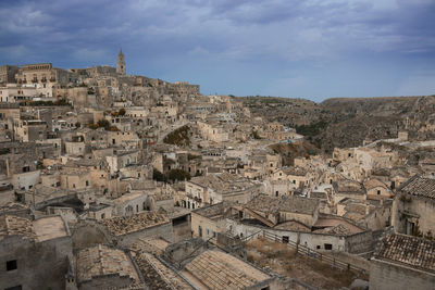 Historic city against cloudy sky