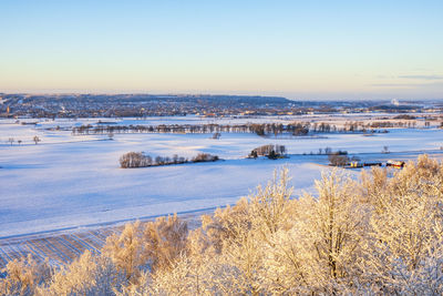 Scenic view of snow covered landscape against sky