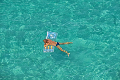 High angle view of person swimming in pool