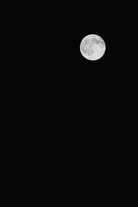 Low angle view of moon against clear sky at night