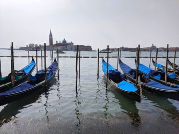 Boats moored in canal