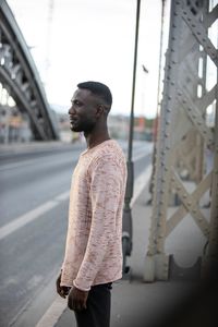 Smiling young man looking away