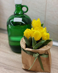 Close-up of yellow flower on table