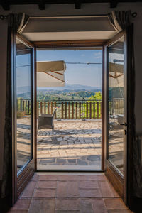 View of sea seen through glass window