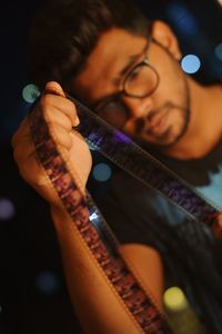 Portrait of man holding guitar