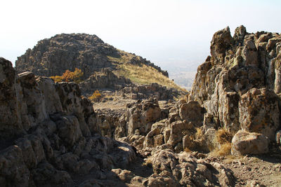 Panoramic view of rocky mountains against clear sky