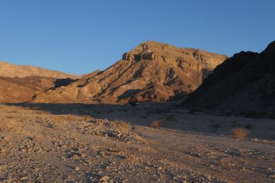 Scenic view of desert against clear sky