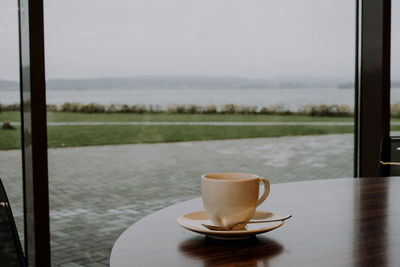 Close-up of coffee cup on table