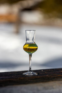 Close-up of wineglass on table