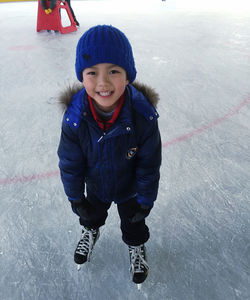 Portrait of smiling boy ice skating