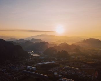 High angle view of city at sunset