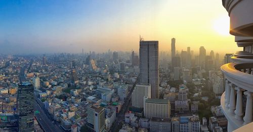 Cityscape against sky during sunset