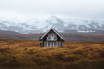 BUILT STRUCTURE ON LANDSCAPE AGAINST SKY