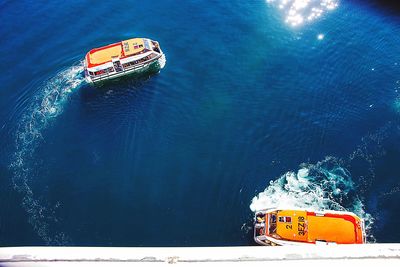 High angle view of cruise ships sailing in sea