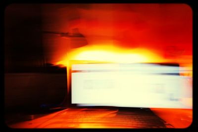 Cars on road at sunset