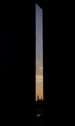 Silhouette of building at sunset