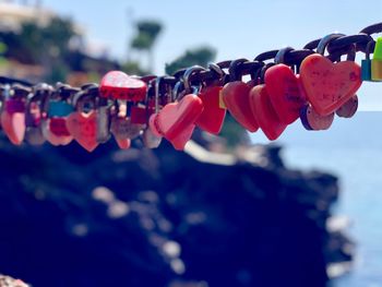 Close-up of padlocks hanging against blurred background