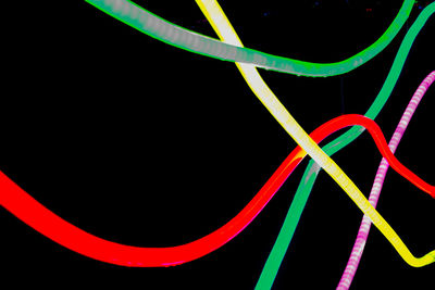 Close-up of light trails over black background