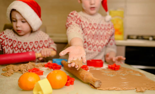 Children making cookie for santa in cosy kitchen. happy new year