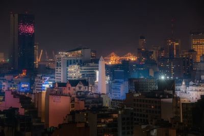 Illuminated buildings in city at night