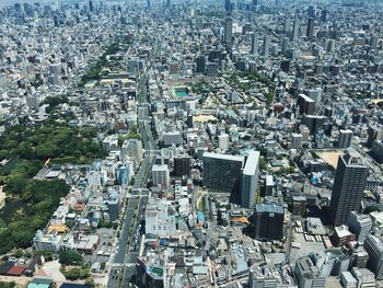 High angle view of crowd and buildings in city