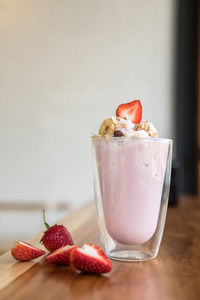 Close-up of ice cream in glass on table