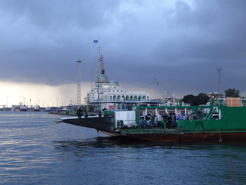 Ship sailing in sea against sky